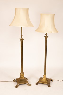 Lot 888 - Two brass standard lamps, the largest 150cm...