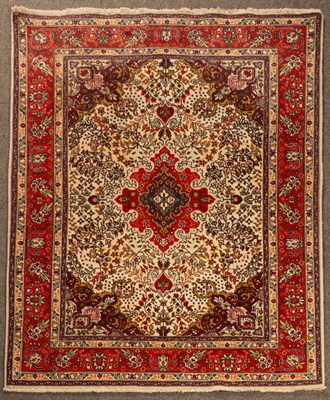 Lot 904 - A North West Persian rug, the ivory field...