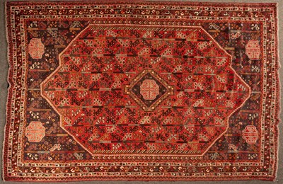 Lot 905 - A Shiraz carpet, South West Persia, the madder...