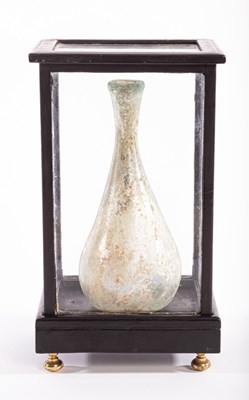 Lot 2 - A Roman glass flask, 2nd -3rd Century AD, in...