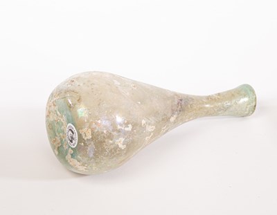 Lot 2 - A Roman glass flask, 2nd -3rd Century AD, in...