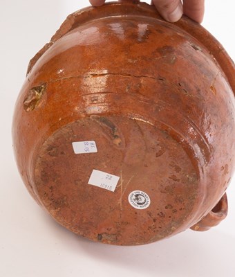 Lot 22 - Two early pottery chamber pots, one 16th...