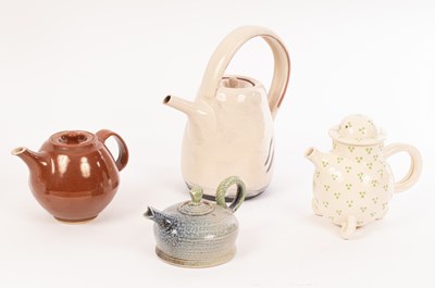 Lot 235 - Four studio pottery teapots comprising a...