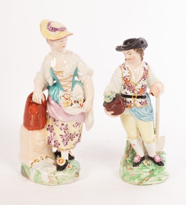 Lot 370 - A matched pair of Derby figures of a boy and...