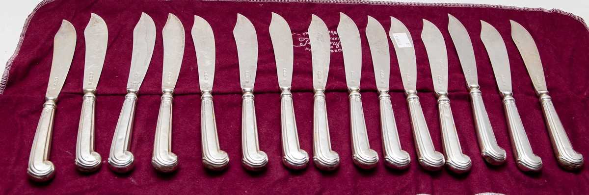 Lot 29 - A set of fifteen Victorian silver fish knives,...