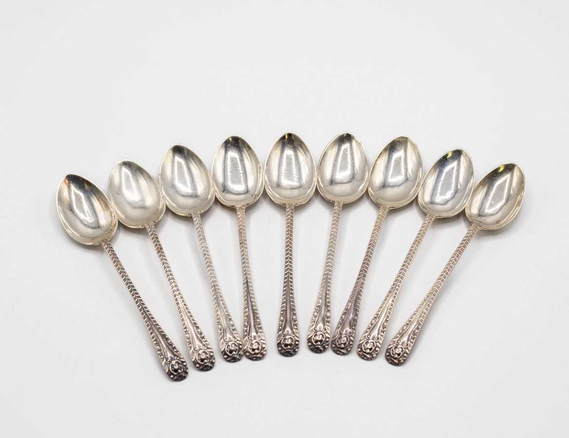 Lot 37 - Nine silver spoons, Sheffield 1907, with...