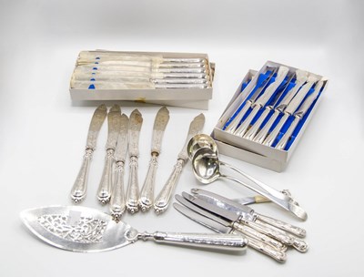 Lot 65 - A set of twelve silver handled table knives...