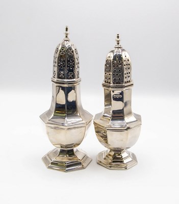 Lot 75 - A matched pair of silver sugar sifters,...