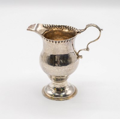 Lot 96 - A George III silver cream jug, makers mark W.K,...