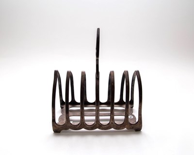 Lot 137 - An Edwardian silver toast rack, James Dixon &...