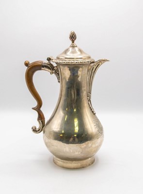 Lot 141 - A George III silver hot water jug, Thomas...