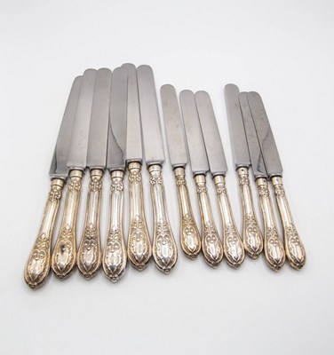 Lot 143 - A set of Victorian silver handled knives,...