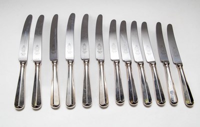 Lot 189 - A set of six table knives with plated handles...