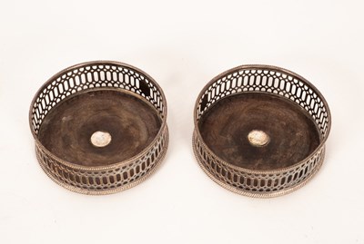 Lot 191 - A pair of silver plated mounted wine coasters,...