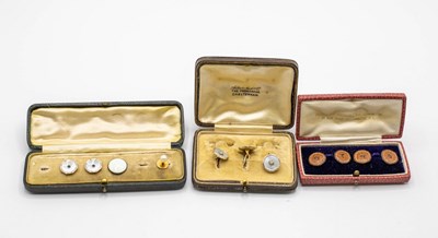 Lot 204 - Three mother-of-pearl studs, the backs stamped...