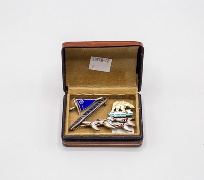 Lot 213 - Four silver and enamel brooches including a...