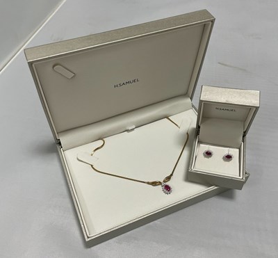 Lot 236 - A 9ct gold ruby and diamond pendant necklace...