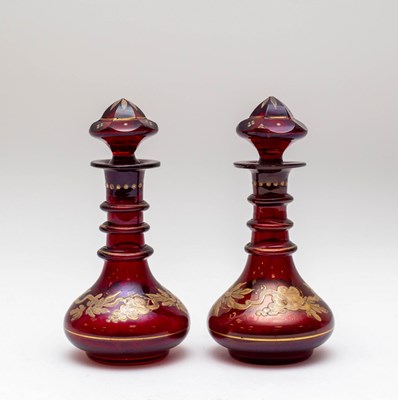 Lot 269 - A pair of ruby glass liqueur bottles and...