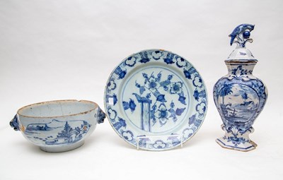 Lot 302 - A Dutch Delft blue and white charger, a vase...