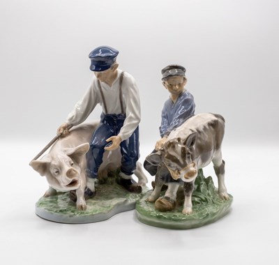 Lot 317 - Two Royal Copenhagen figure groups of boys...