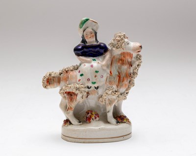 Lot 337 - A small Staffordshire pottery flatback figure...