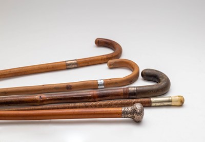 Lot 405 - An embossed silver topped walking stick,...