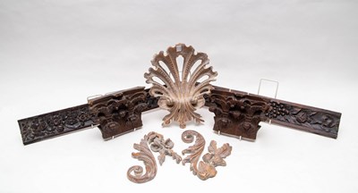 Lot 421 - A pair of carved wood capitals and three other...