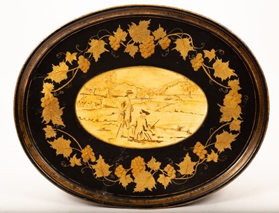 Lot 423 - An oval toleware tray with a central pastoral...