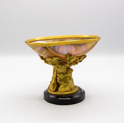 Lot 431 - A mother-of-pearl shell bowl, the gilded stand...