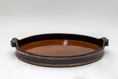 Lot 447 - A George III mahogany and brass bound oval...