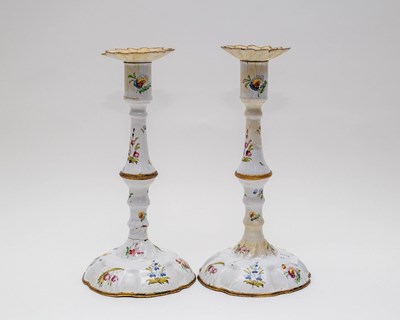 Lot 450 - A pair of enamel candlesticks, probably...