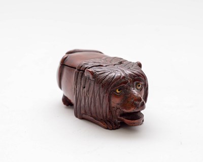 Lot 469 - A coquilla nut lion snuff box, 19th Century,...