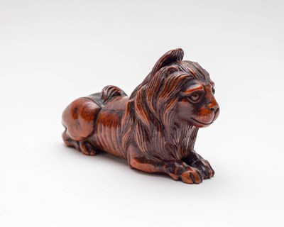 Lot 471 - A lion fruitwood snuff box, 19th Century,...