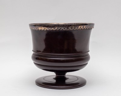 Lot 475 - A lignum vitae wassail bowl, 17th Century,...