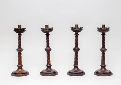 Lot 476 - Four wooden candlesticks, in the Gothic manner...