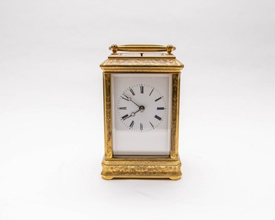 Lot 512 - A brass carriage clock, engraved decoration,...