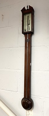 Lot 515 - A George III stick barometer, the mahogany...