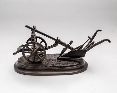 Lot 588 - A bronze model of a plough, 19th Century, on...