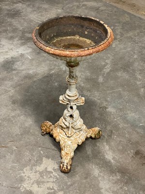 Lot 603 - A cast iron bird bath with dolphin support,...