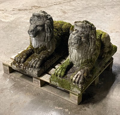 Lot 611 - A pair of well weathered reconstituted stone...