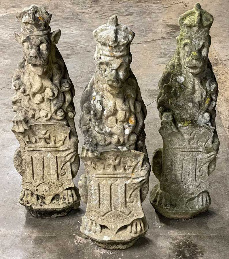Lot 617 - Three carved stone figures of lions, each...