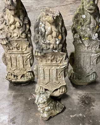 Lot 617 - Three carved stone figures of lions, each...