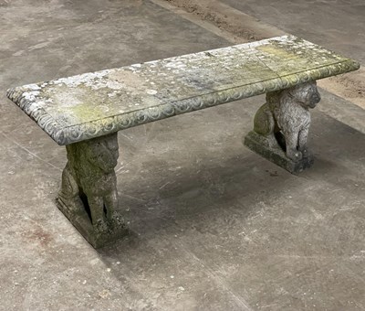 Lot 648 - A reconstituted stone bench on Griffin...