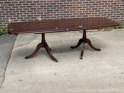 Lot 688 - A mahogany veneered twin pedestal dining table,...