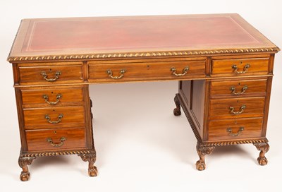 Lot 689 - A carved mahogany pedestal desk, 20th Century,...