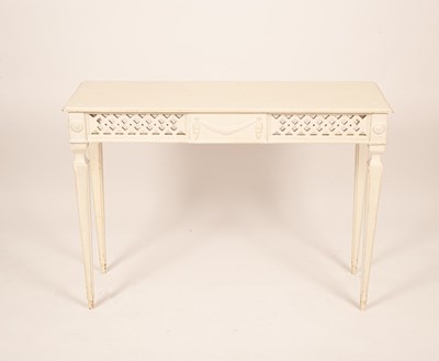 Lot 699 - A white painted side table with a pierced...