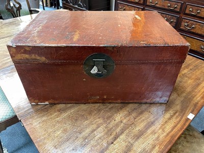 Lot 708 - A lacquered chest with handles to the sides,...