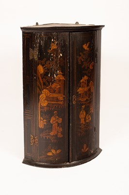 Lot 722 - An early 19th Century bowfront corner cupboard...