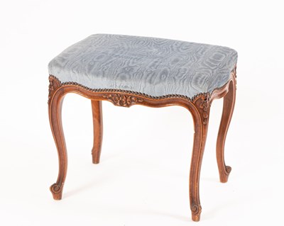 Lot 724 - An upholstered footstool on cabriole legs,...