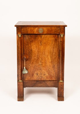 Lot 735 - An Empire style plinth cupboard with frieze...